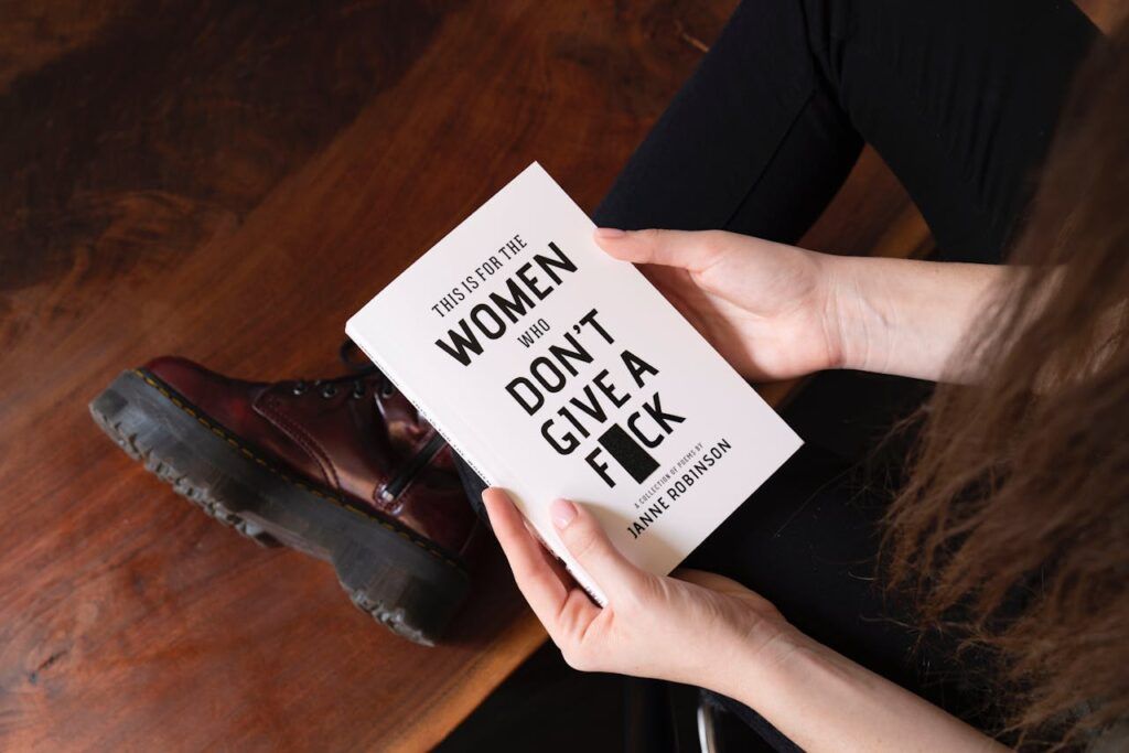 pexels-photo-2228586 Woman Holding White Book